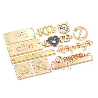 Placa de logotipo metálica